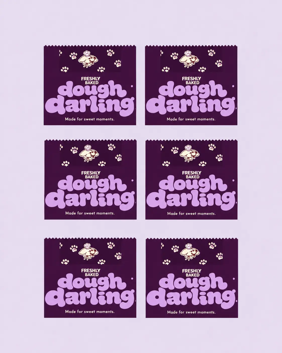 A pattern of Dough Darling cookie sleeves in deep plum with lilac lettering